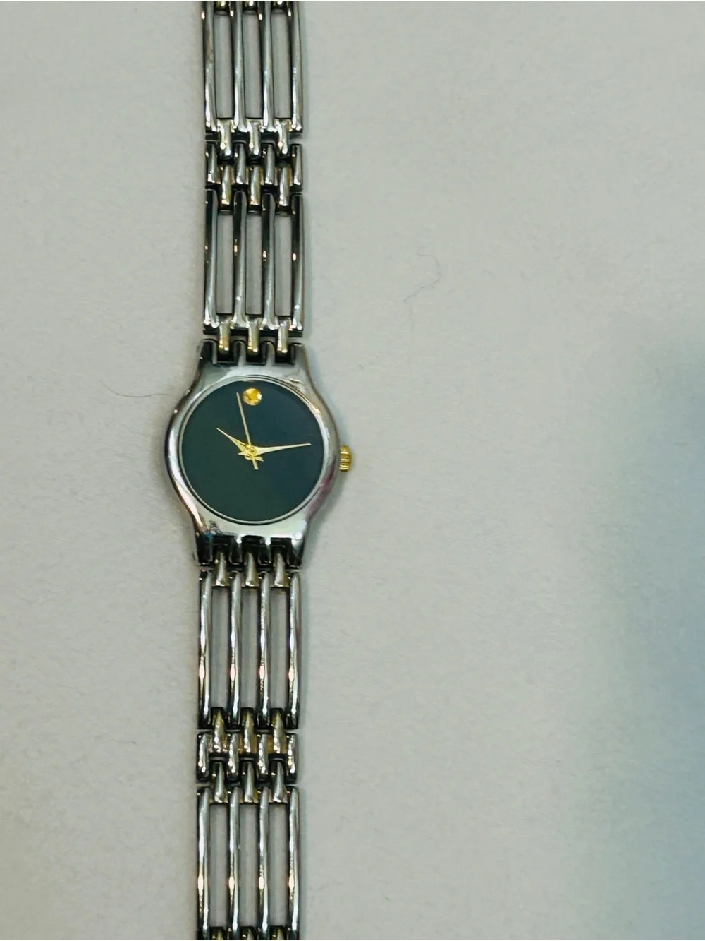 Women's Silver Bracelet Watch with Black Dial and Gold Accents